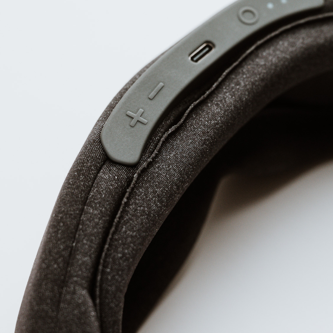 Close-up of the Midnight Black Aura Smart Sleep Mask Controls and the material