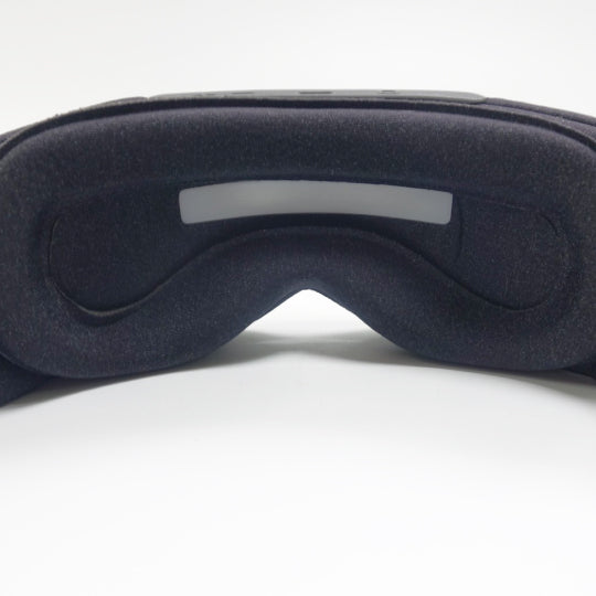 Close-up view of the Aura Smart Sleep Mask's - Sunrise Wake-Up Light Feature in a white background