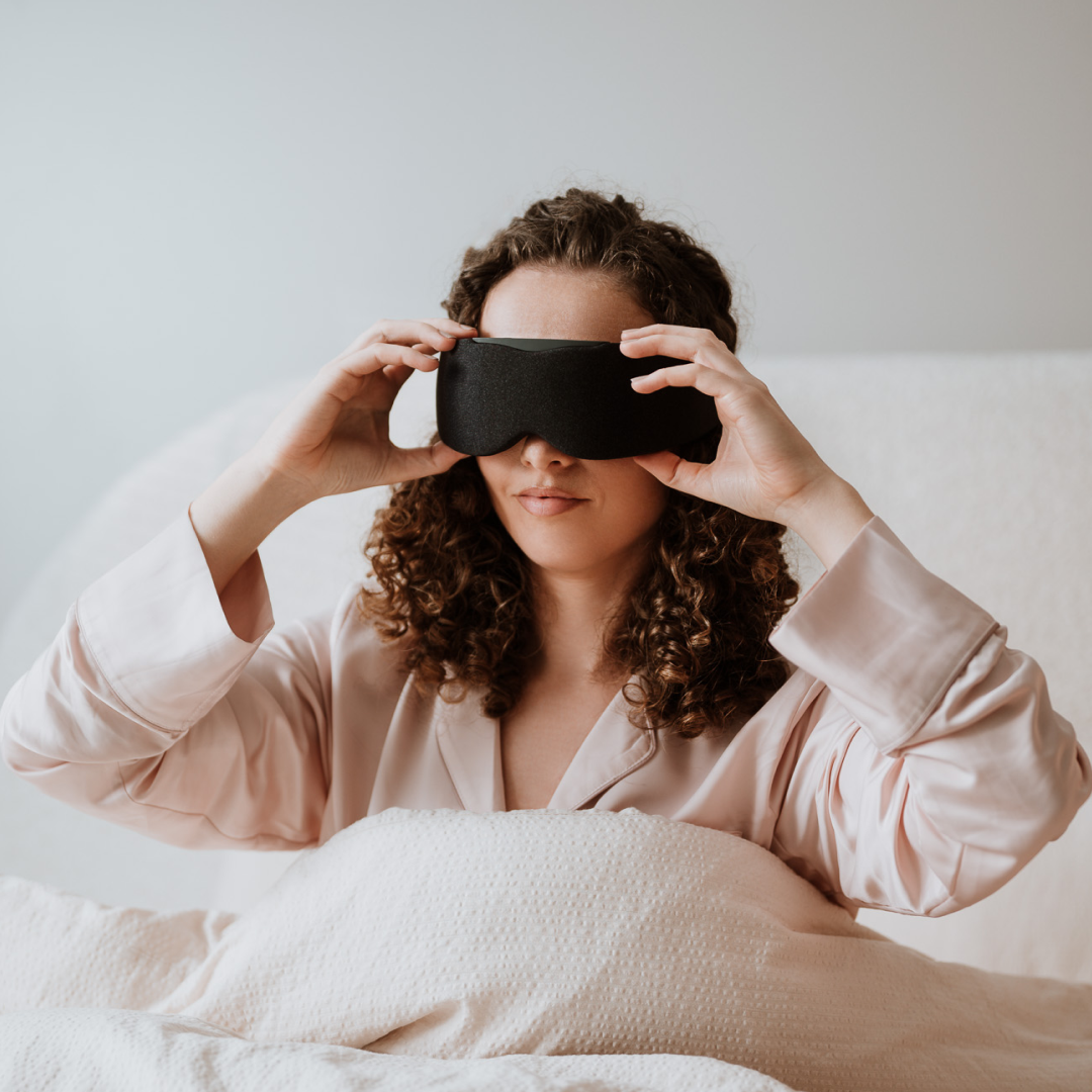 Woman Adjusting Grey Aura Smart Sleep Mask 
